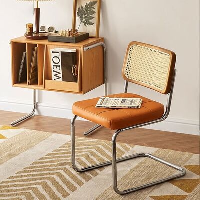 Buen precio Silla de comedor de madera sólida para el hogar de comedor de acero inoxidable para conferencias de cafetería silla de ocio de rotín en línea